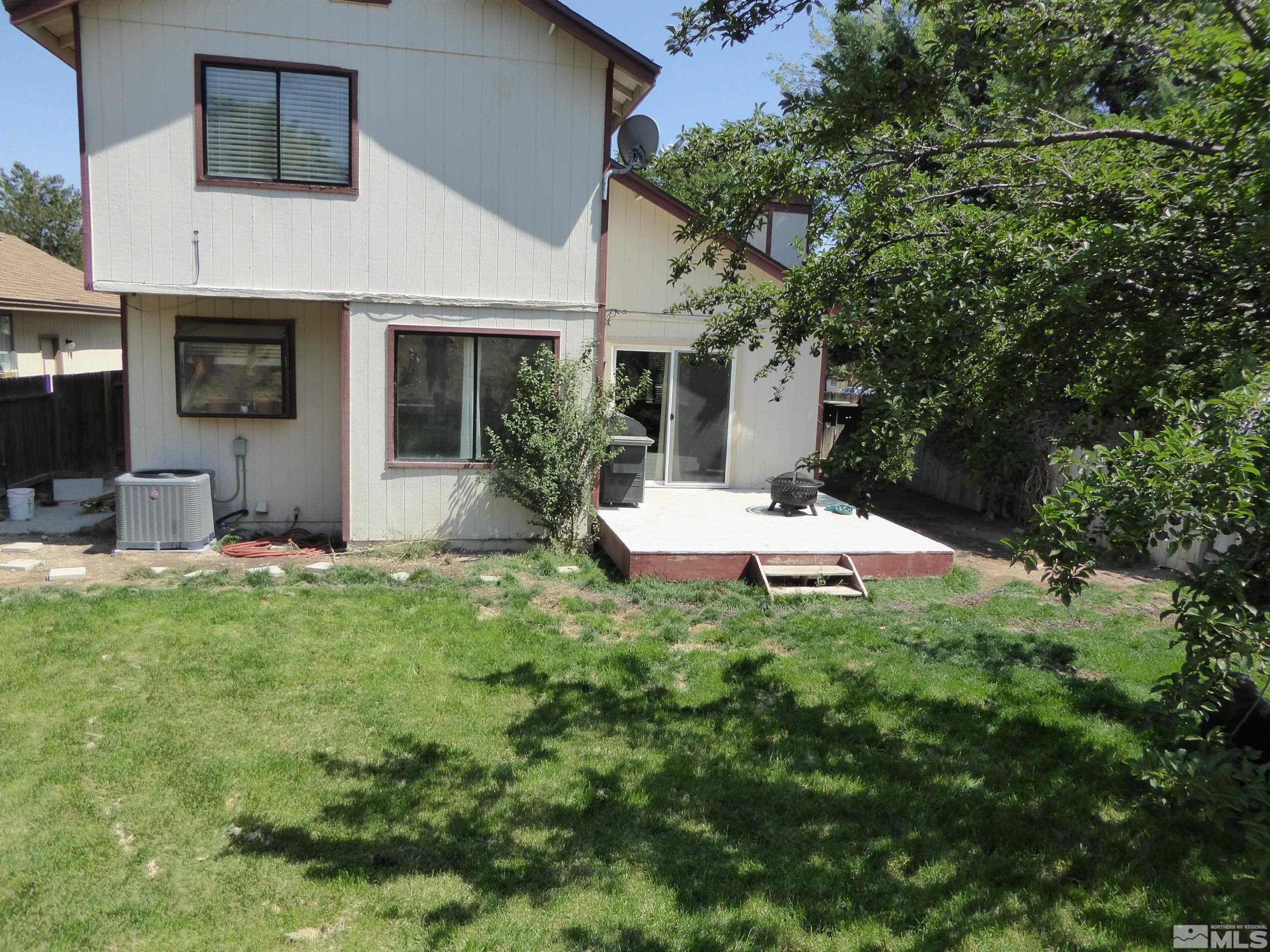 1915 Amarak Way Reno, NV 89523 - Photo 24 of 25 a view of a house with backyard sitting area and garden