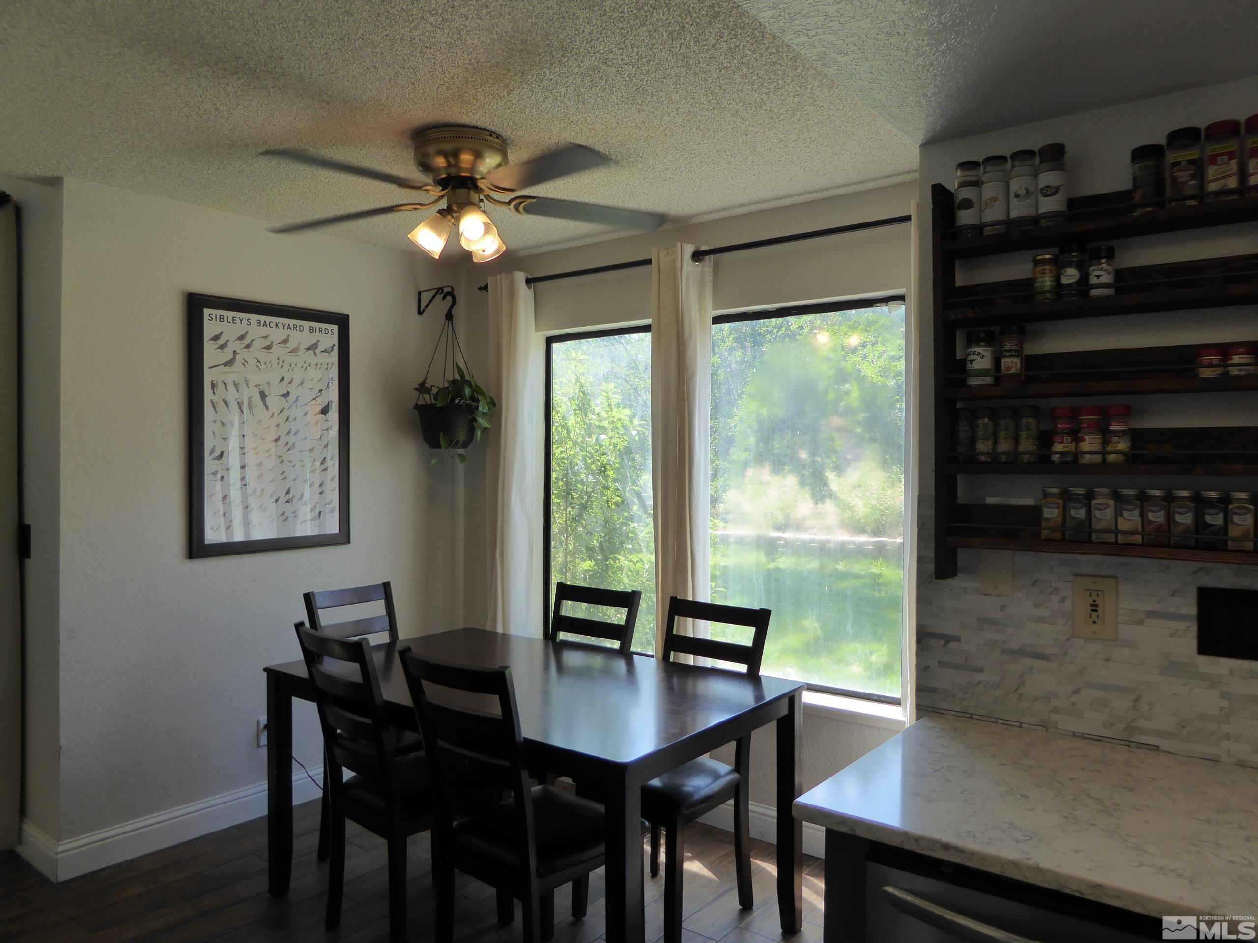 1915 Amarak Way Reno, NV 89523 - Photo 10 of 25 a view of a dining room with furniture window and wooden floor