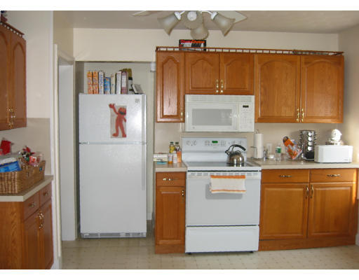 897 Webster Street Needham, MA 02492 - Photo 5 of 8 a view of kitchen with cabinets and refrigerator