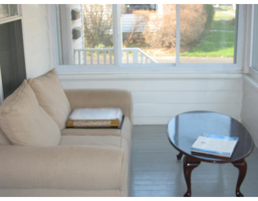 897 Webster Street Needham, MA 02492 - Photo 6 of 8 a living room with furniture and a window