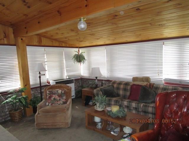 17 Community Springs Drive Rochester, PA 15074 - Photo 7 of 16 This sunken family room is a great space for entertaining - warm all wooden ceiling adds a gentle warmth to the area.