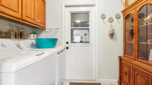 a kitchen with a refrigerator and cabinets