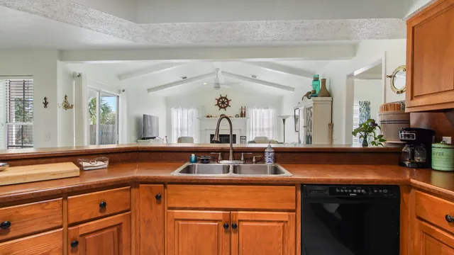 a kitchen with a sink and cabinets