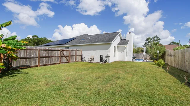 a view of a backyard with a garden
