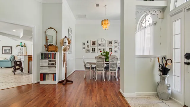 a view of a livingroom with furniture wooden floor and a window