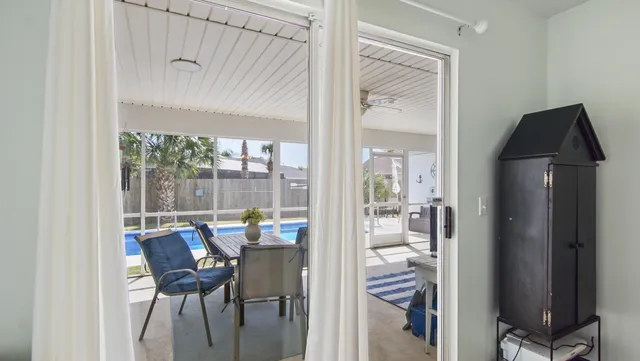 a dining room with furniture and wooden floor