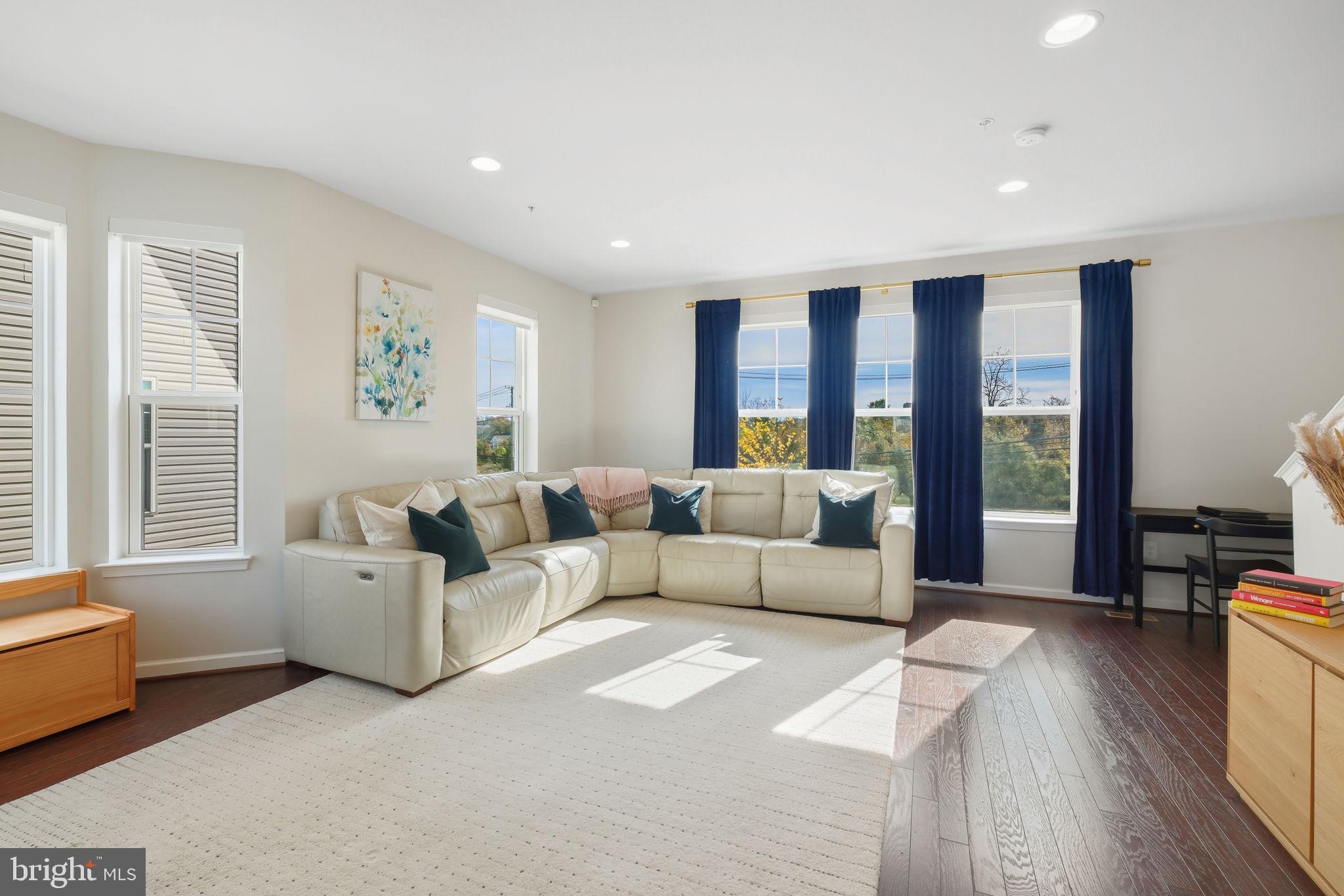 15635 Trolley Lane Silver Spring, MD 20906 - Photo 16 of 41 a living room with furniture and a large window