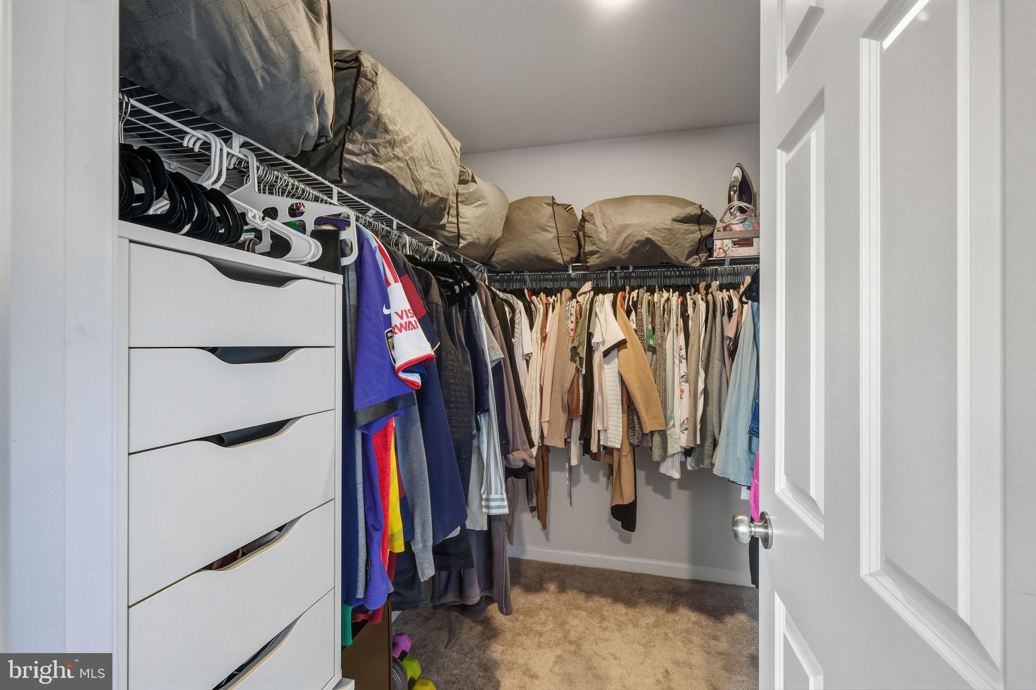 15635 Trolley Lane Silver Spring, MD 20906 - Photo 24 of 41 a view of walk in closet with clothes and shoes