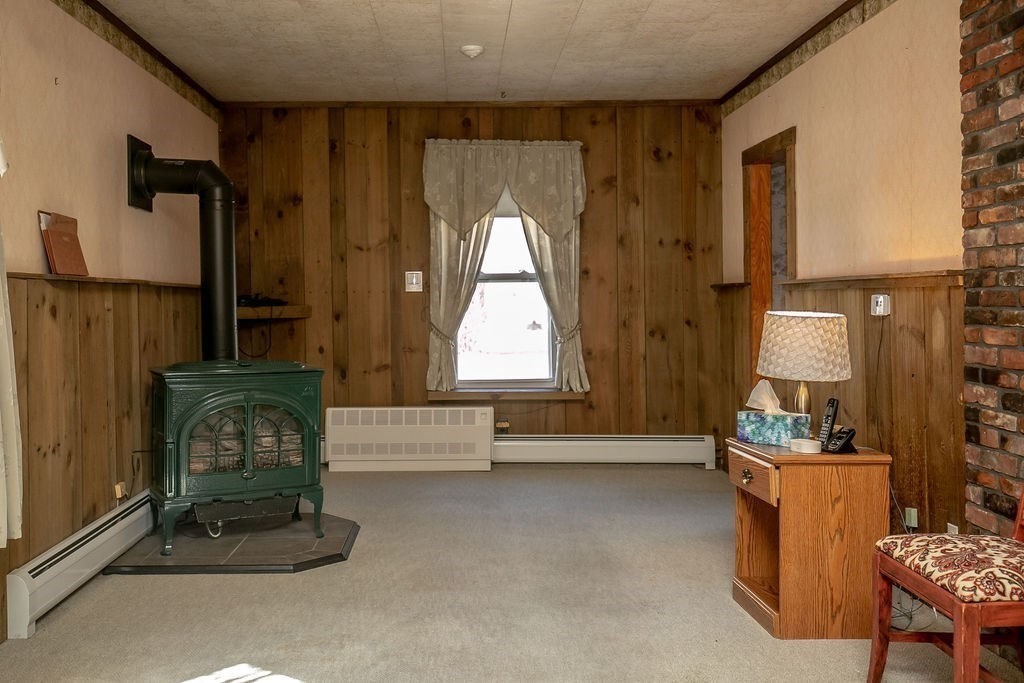 231 River Road Florida, MA 01367 - Photo 14 of 40 a living room with furniture and a fireplace