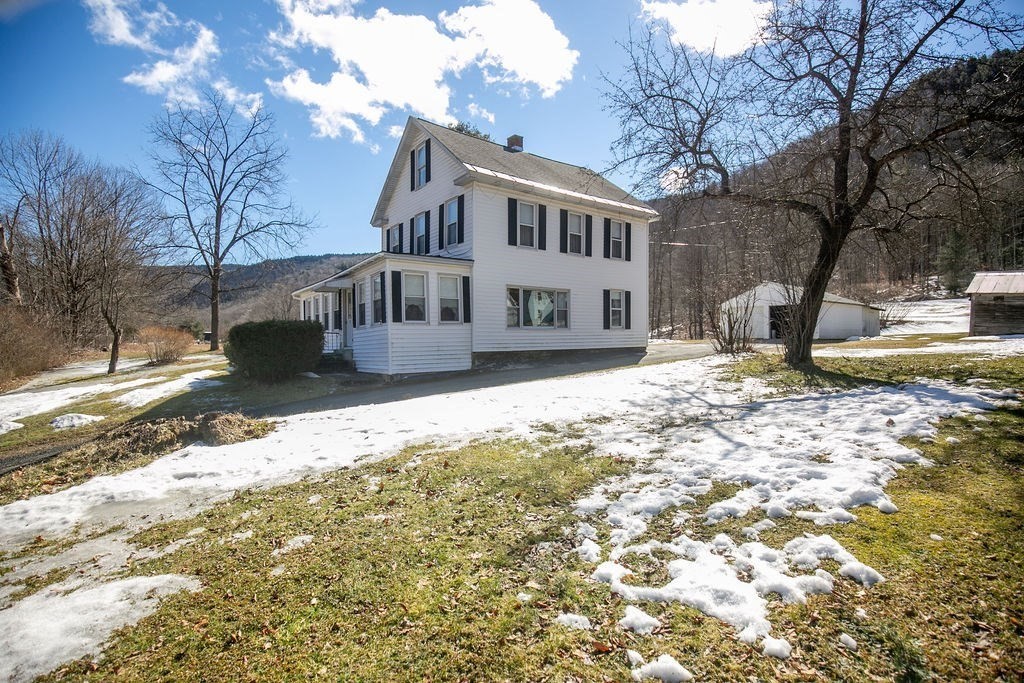 231 River Road Florida, MA 01367 - Photo 2 of 40 a view of a house with a yard covered in snow