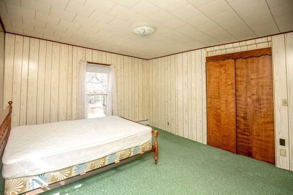 231 River Road Florida, MA 01367 - Photo 25 of 40 a bedroom with a bed and a window
