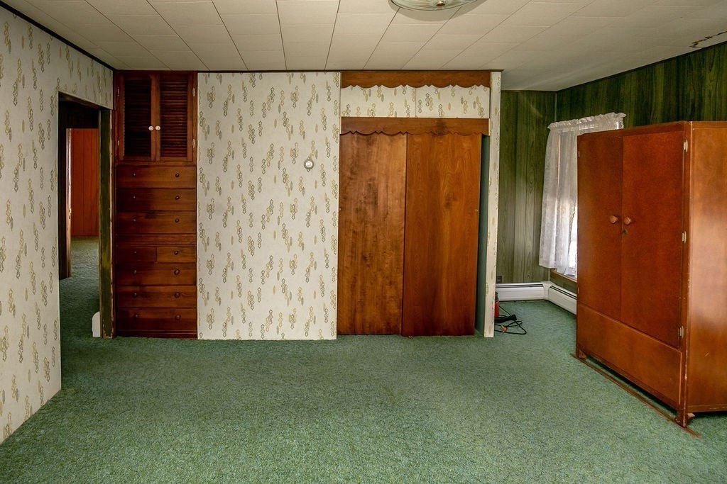231 River Road Florida, MA 01367 - Photo 27 of 40 an empty room with closet wooden shelves
