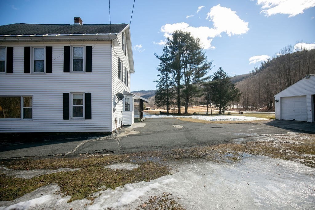 231 River Road Florida, MA 01367 - Photo 36 of 40 a front view of a house with a yard