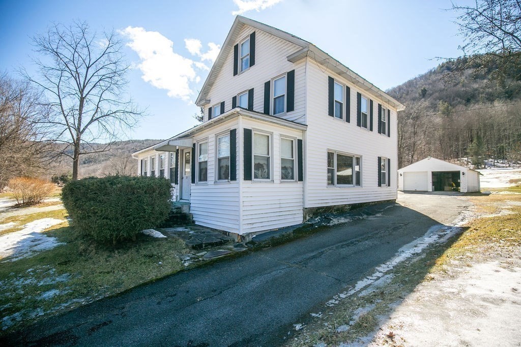 231 River Road Florida, MA 01367 - Photo 39 of 40 a front view of a house with a yard