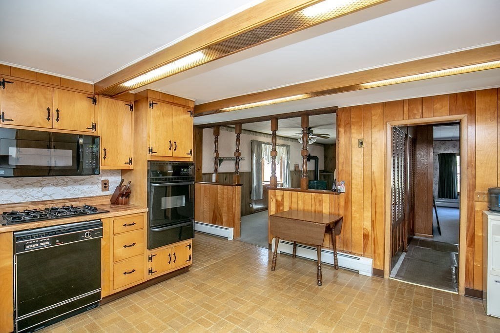 231 River Road Florida, MA 01367 - Photo 7 of 40 a kitchen with granite countertop a stove and cabinets