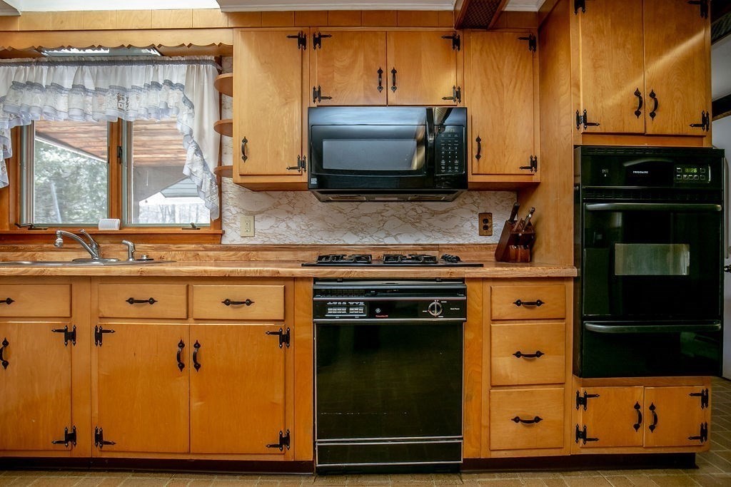 231 River Road Florida, MA 01367 - Photo 8 of 40 a kitchen with stainless steel appliances granite countertop a stove and a microwave