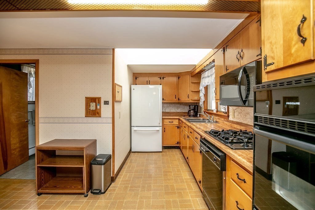 231 River Road Florida, MA 01367 - Photo 10 of 40 a kitchen with stainless steel appliances a stove and a refrigerator