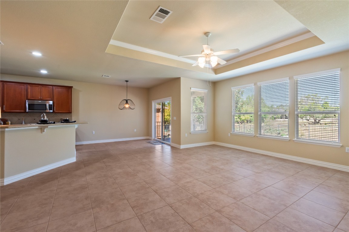 106 Trinity Lane Georgetown, TX 78633 - Photo 12 of 24 a view of an empty room with kitchen and a window