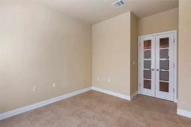 a view of an empty room with empty shelves