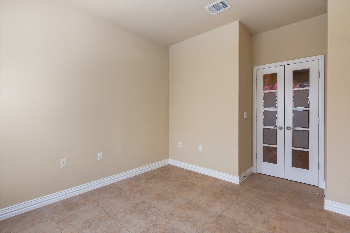106 Trinity Lane Georgetown, TX 78633 - Photo 7 of 24 a view of an empty room with empty shelves