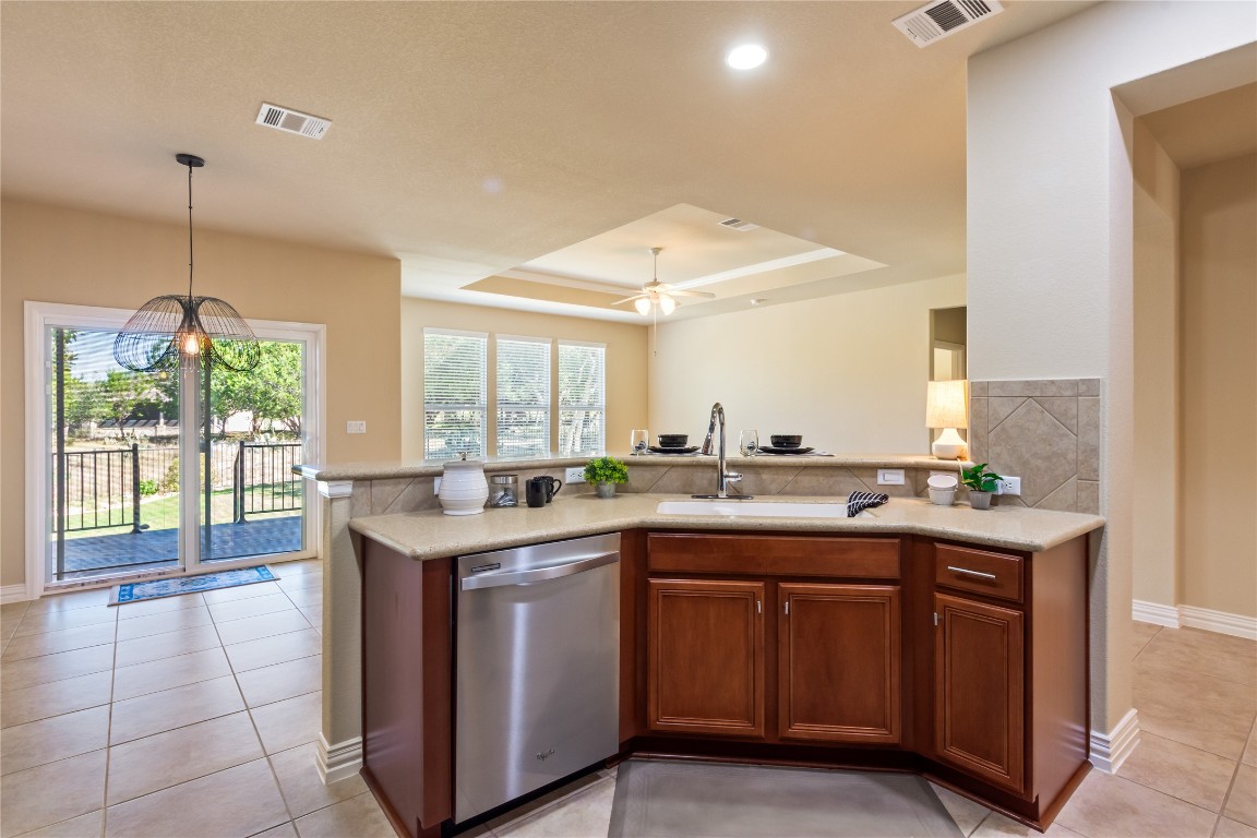 106 Trinity Lane Georgetown, TX 78633 - Photo 10 of 24 a kitchen with a sink and cabinets