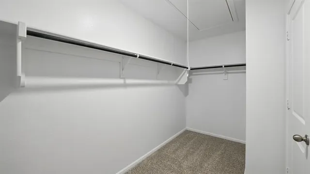 a bathroom with a double vanity sink toilet and shower