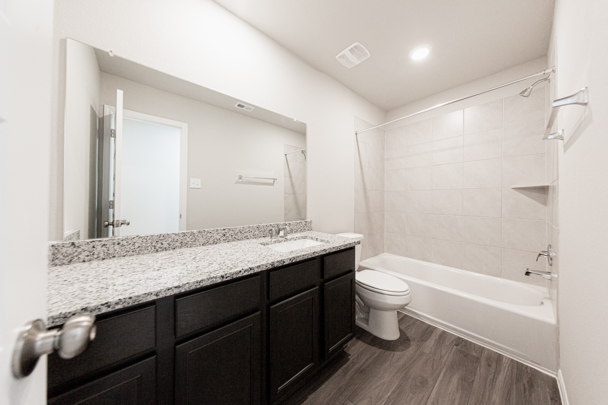13663 Kit Run Splendora, TX 77372 - Photo 12 of 28 a bathroom with a granite countertop sink toilet and shower