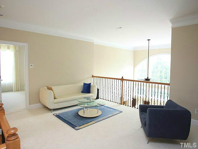 2259 Clayette Court Raleigh, NC 27612 - Photo 15 of 25 a living room with furniture and a wooden floor