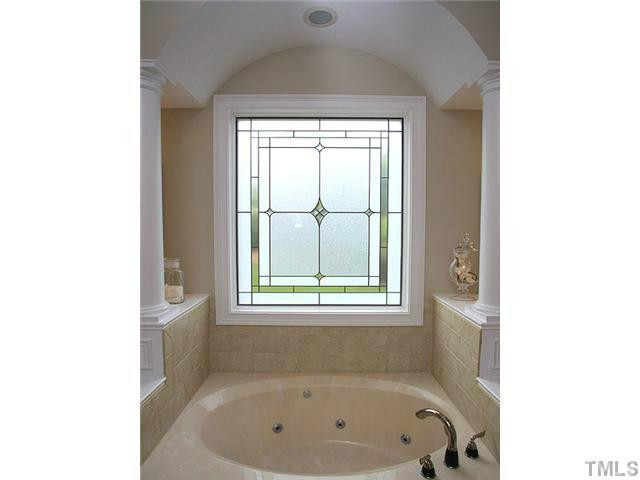 2259 Clayette Court Raleigh, NC 27612 - Photo 18 of 25 a bathroom with a bathtub and a window