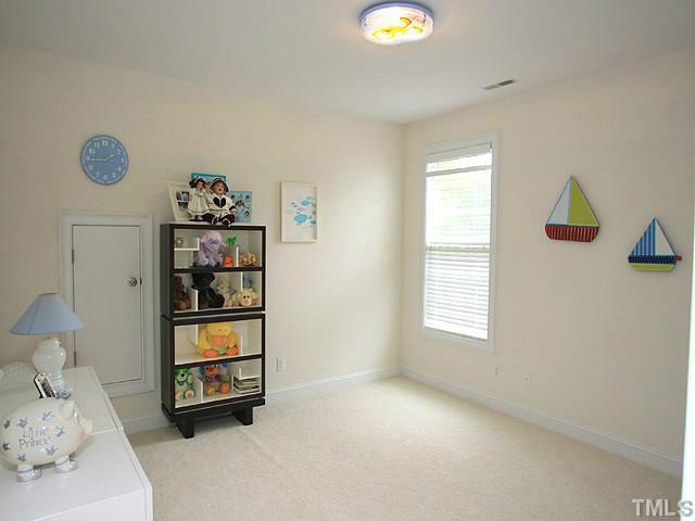 2259 Clayette Court Raleigh, NC 27612 - Photo 22 of 25 a view of room with baby crib and window
