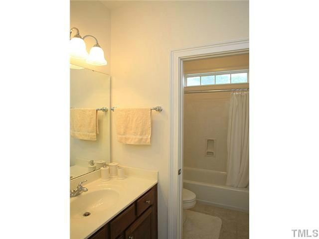 2259 Clayette Court Raleigh, NC 27612 - Photo 23 of 25 a bathroom with a sink and a mirror