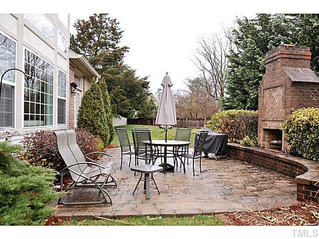 2259 Clayette Court Raleigh, NC 27612 - Photo 25 of 25 a view of a patio with a dining table and chairs