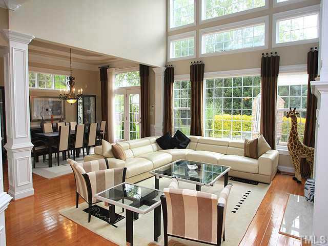 2259 Clayette Court Raleigh, NC 27612 - Photo 7 of 25 a living room with furniture and floor to ceiling windows