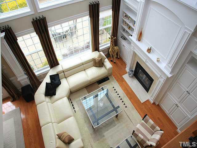 2259 Clayette Court Raleigh, NC 27612 - Photo 8 of 25 a living room with furniture and a fireplace