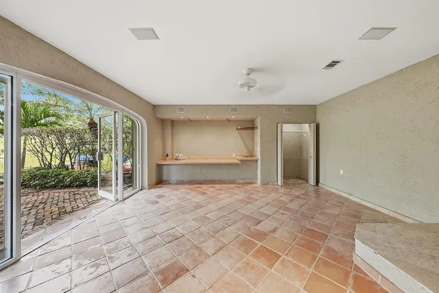 a bathroom with a tub shower and sink