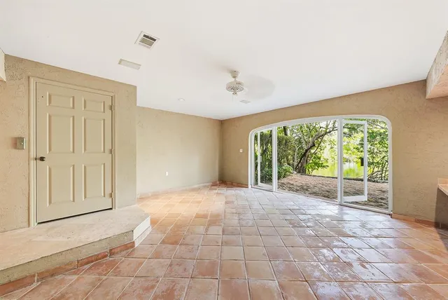 a kitchen with a sink cabinets and appliances