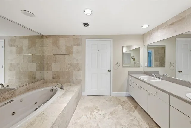 a front view of a house with a yard and green space