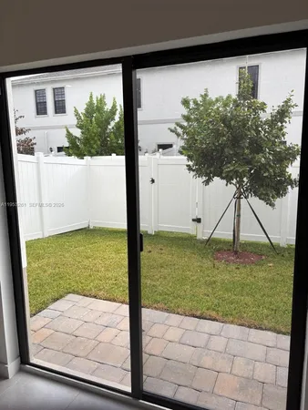 a view of a backyard of the house