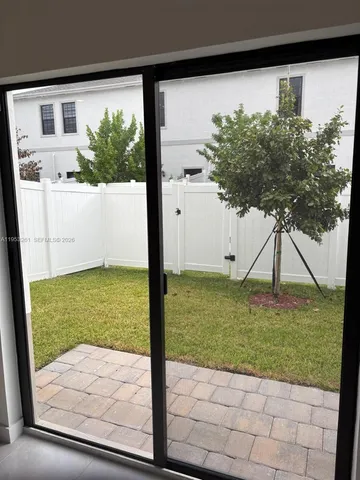 a view of a backyard of the house