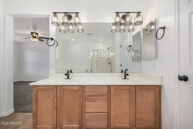 a bathroom with a sink and mirror