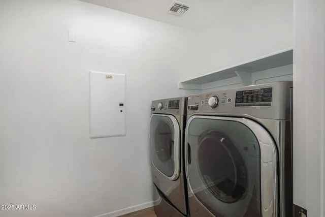 a utility room with dryer and washer