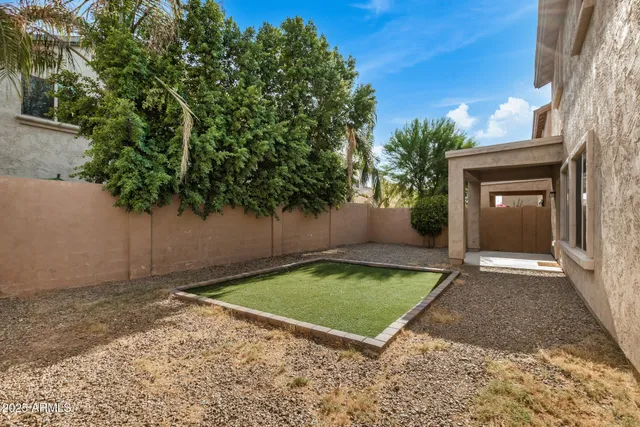 a view of a backyard with a small cabin