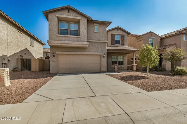 a front view of a house with yard