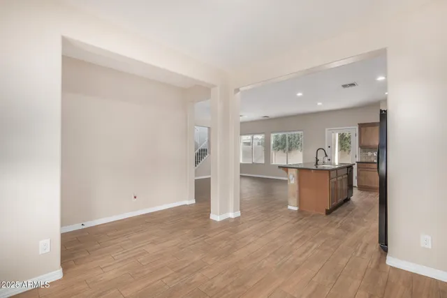 a view of kitchen and wooden floor