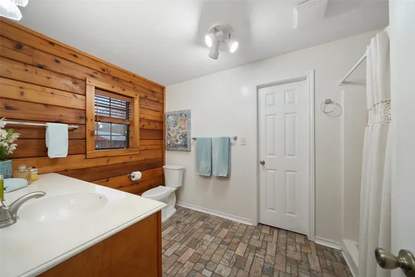 a bedroom with a bed and a walk in closet