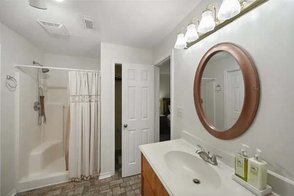 a bathroom with a sink and a mirror