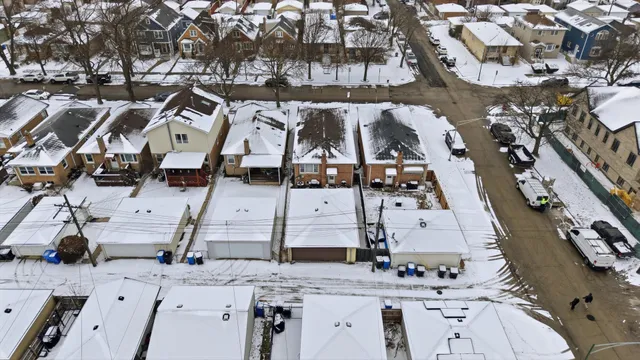 an aerial view of residential houses with outdoor space
