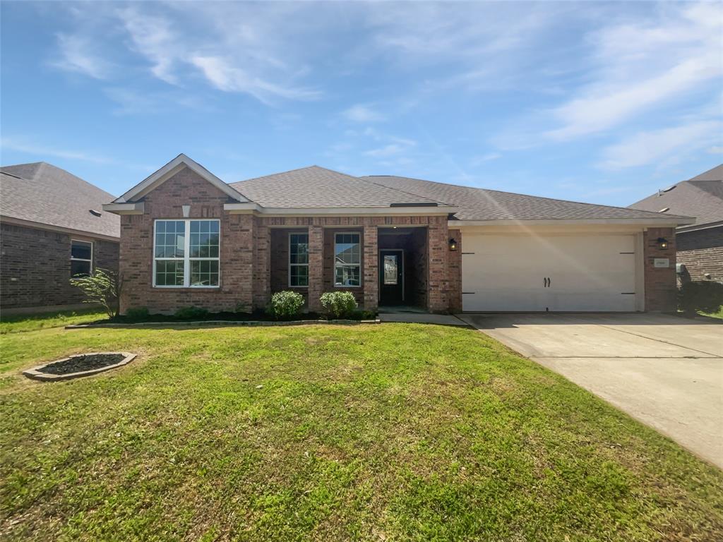 2500 Spring Meadows Drive Denton, TX 76209 - Photo 1 of 1 a front view of a house with a garden