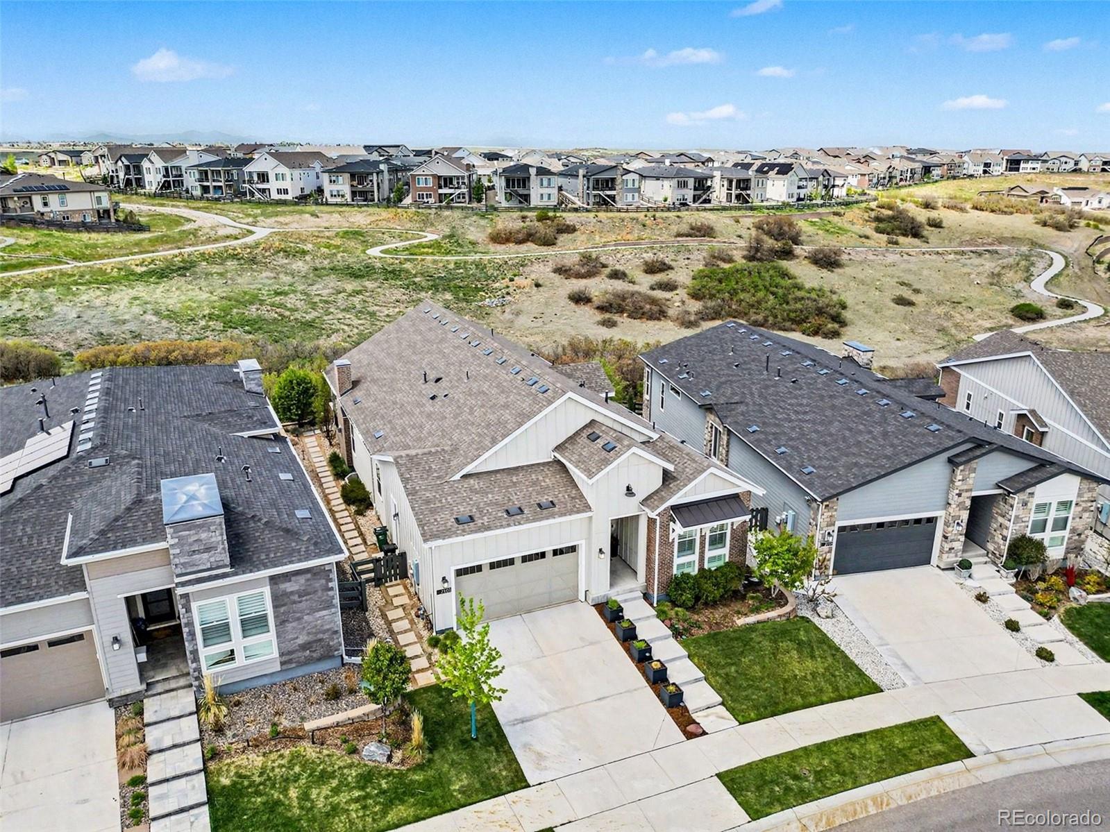 2101 Rim Ridge Drive Castle Pines, CO 80108 - Photo 39 of 50 an aerial view of residential houses with outdoor space and ocean