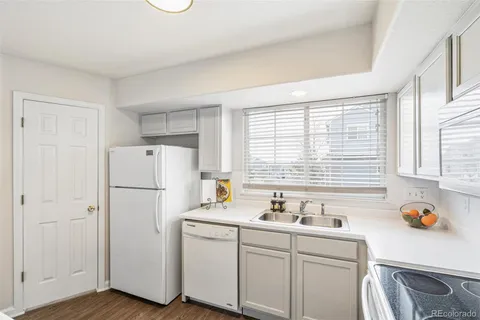a white refrigerator freezer sitting inside of a kitchen